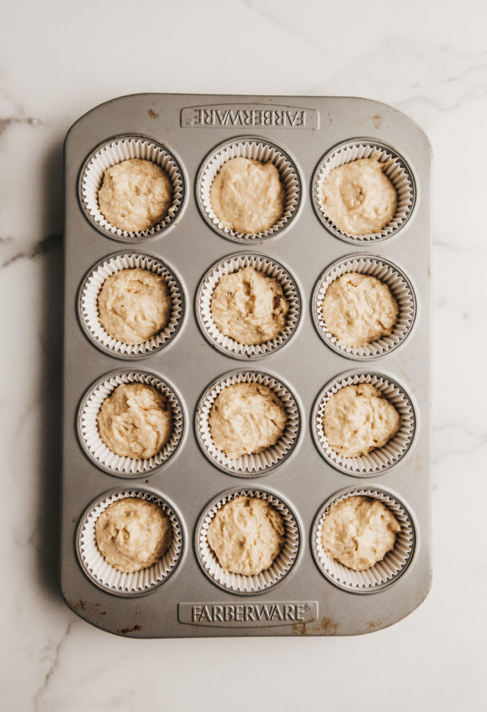 muffin tin with sour cream coffee cake batter