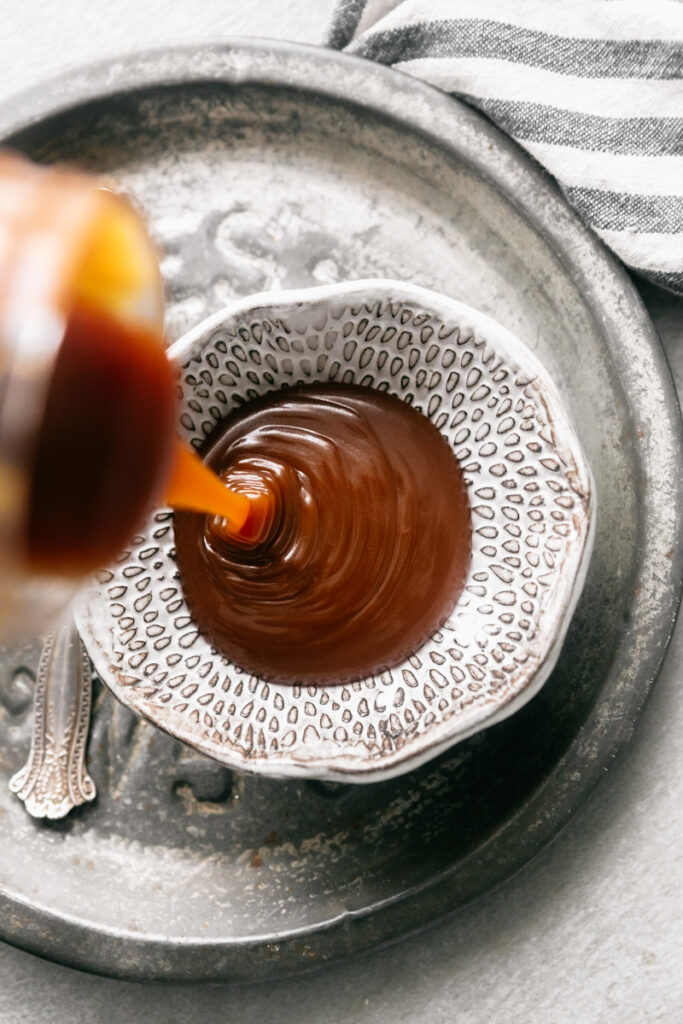 Pouring caramel into a bowl 