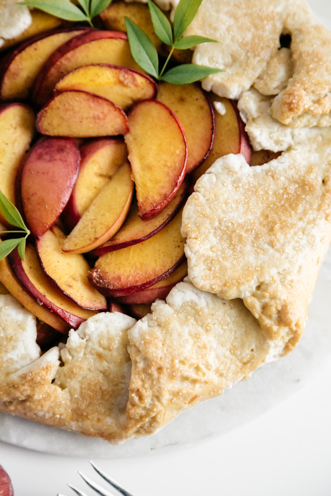 Closeup of baked peach galette. 