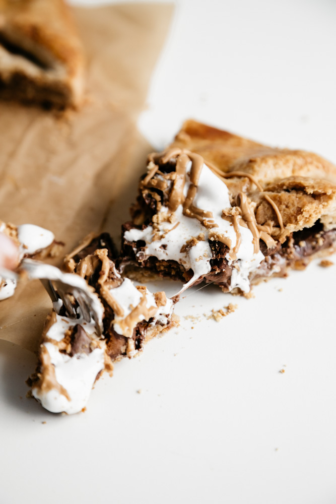 Slice of a peanut butter cup s’mores galette. 