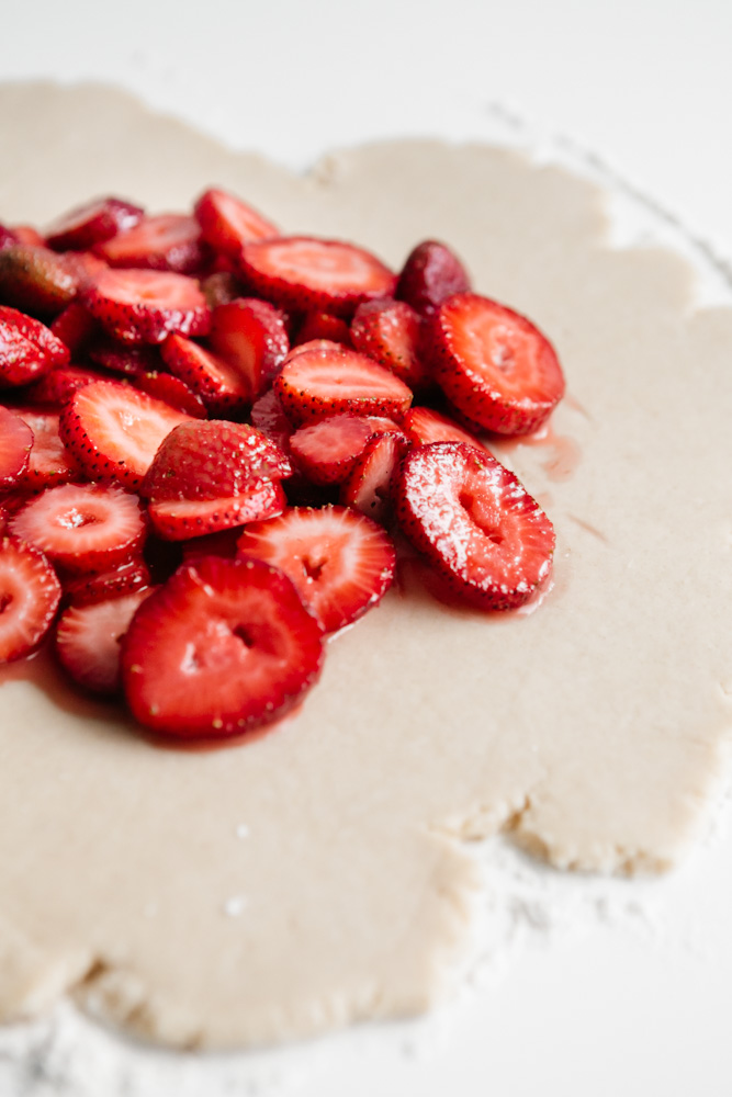 Pie dough with fresh strawberries. 