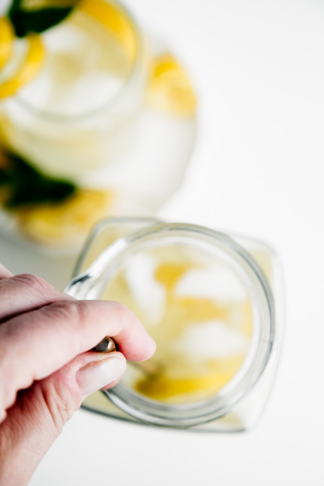 Stirring sweet and simple lemonade. 