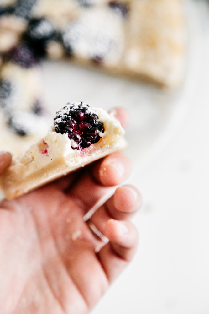 Bite of fresh blackberry cheesecake galette. 