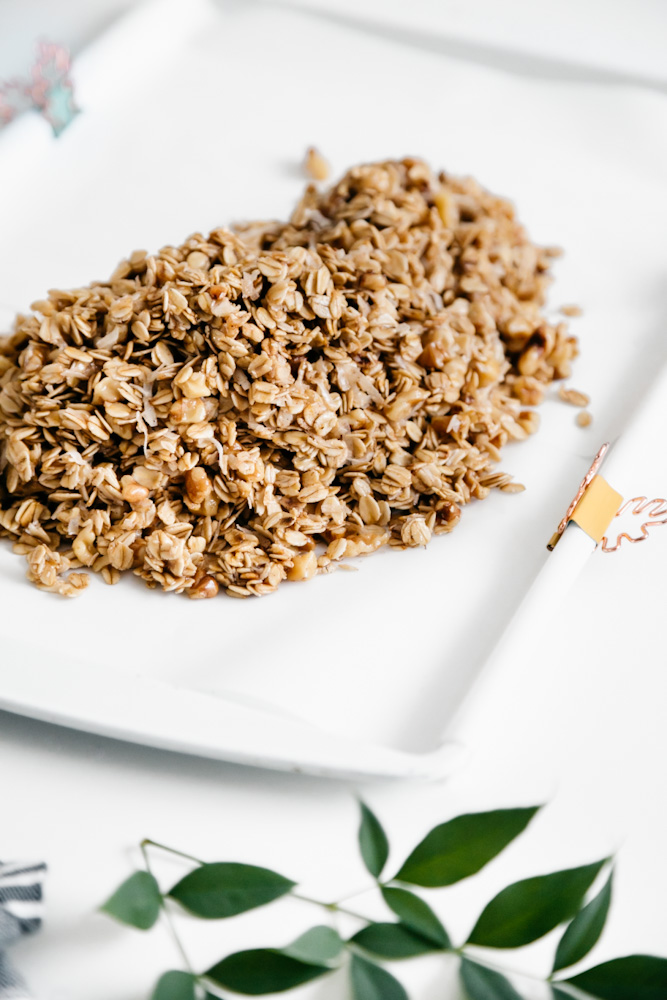 Unbaked granola on a baking sheet. 