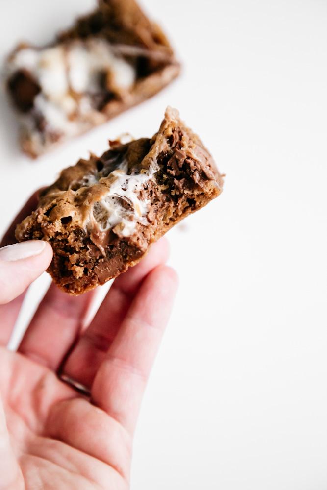 A bite out of a cookie bar. 