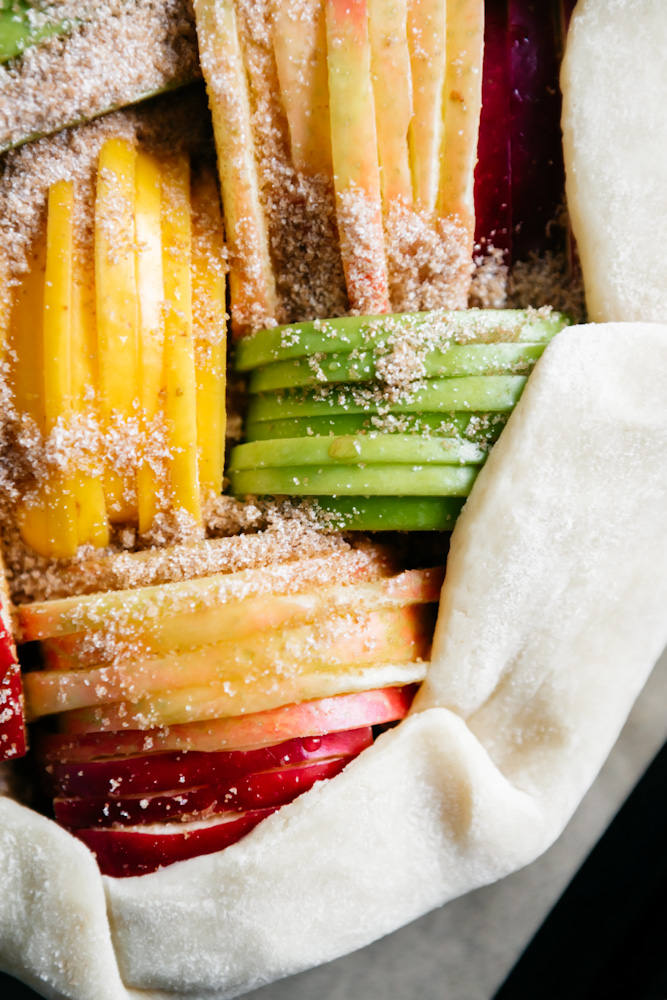 Closeup of colorful apples in a pie crust 
