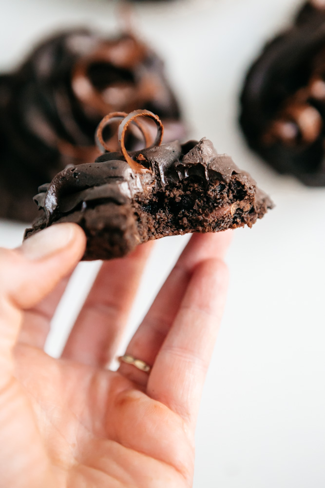 Holding a Frosted Chocolate Fudge Cookies