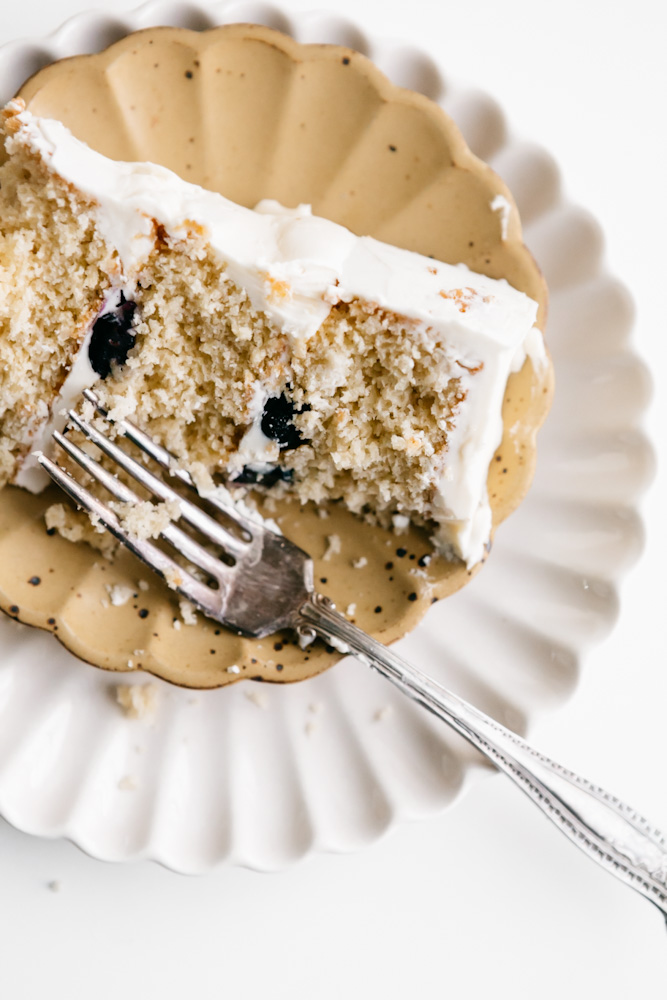 A slice of a Gluten free lemon blueberry cake 