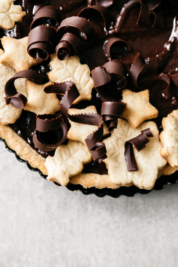 Closeup of choclate curls on a tart 