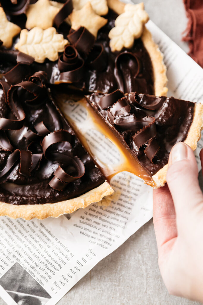 A slice of Caramel Chocolate Twix Tart