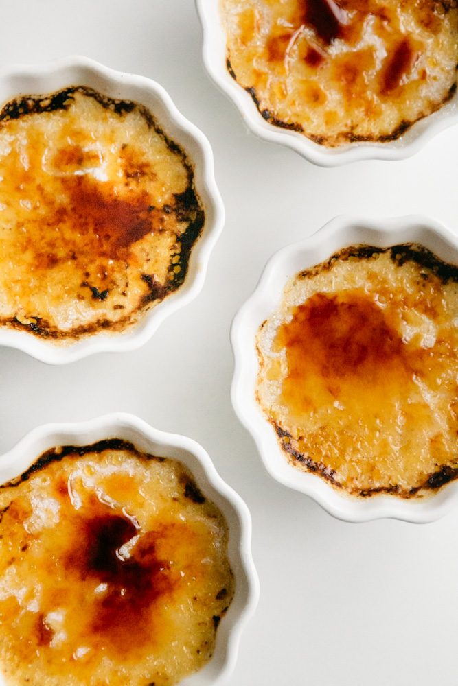 Close up of creme brûlée’s in white dishes 