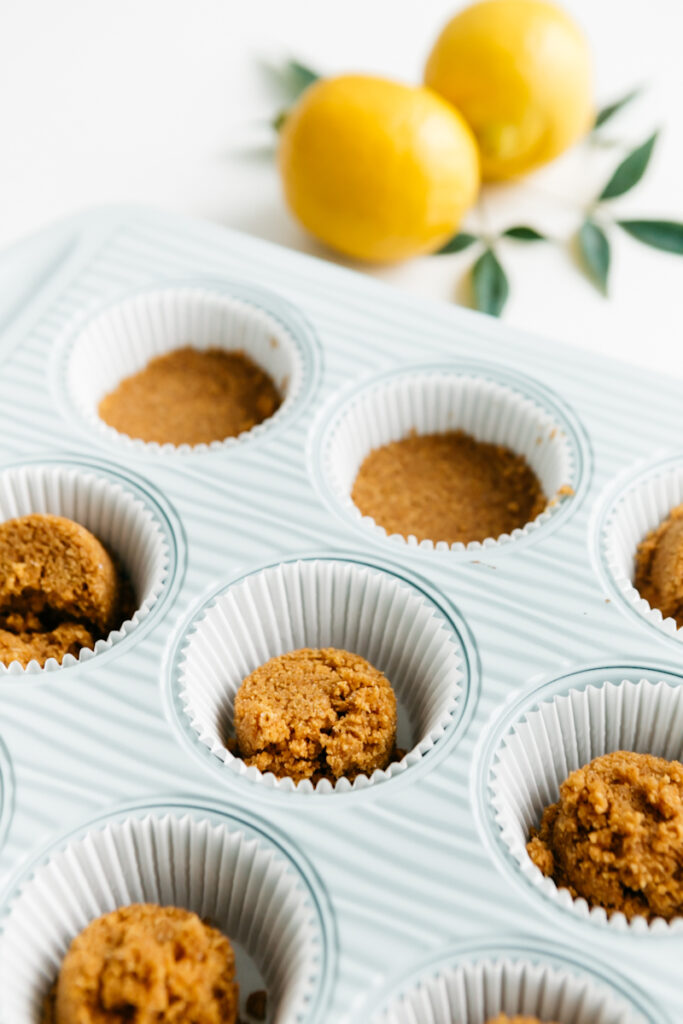 Graham cracker crusts in a cupcake tin