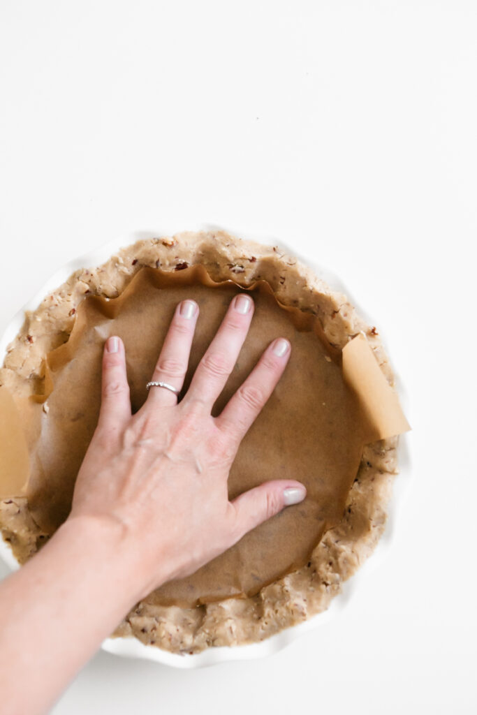 Parchment paper lining pie crust for blind baking 