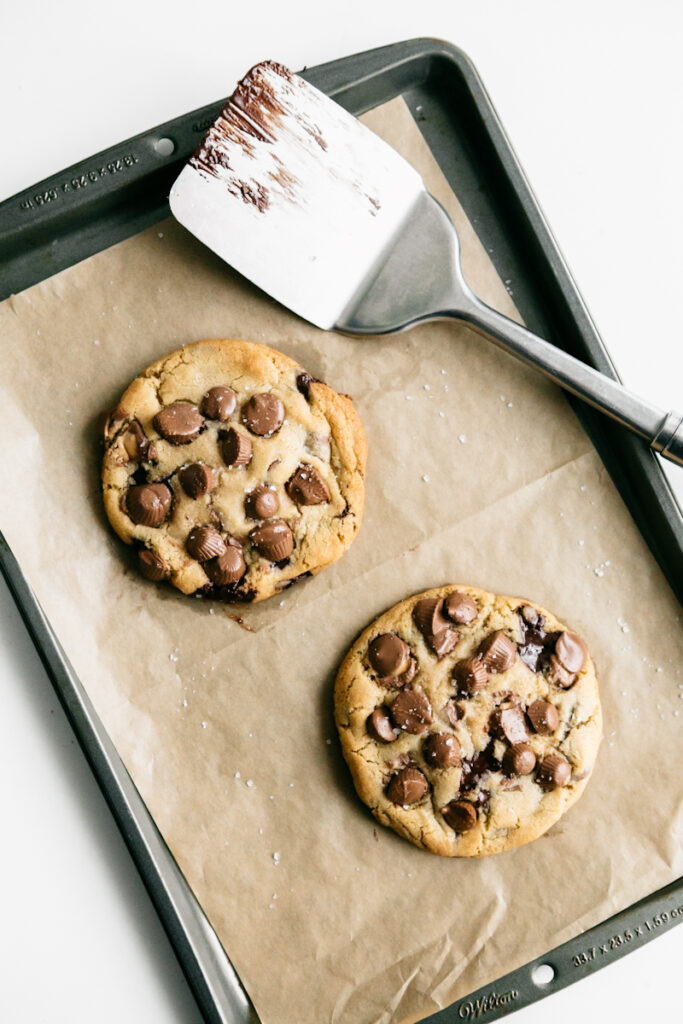 Two peanut butter cup cookies On a baking dish 