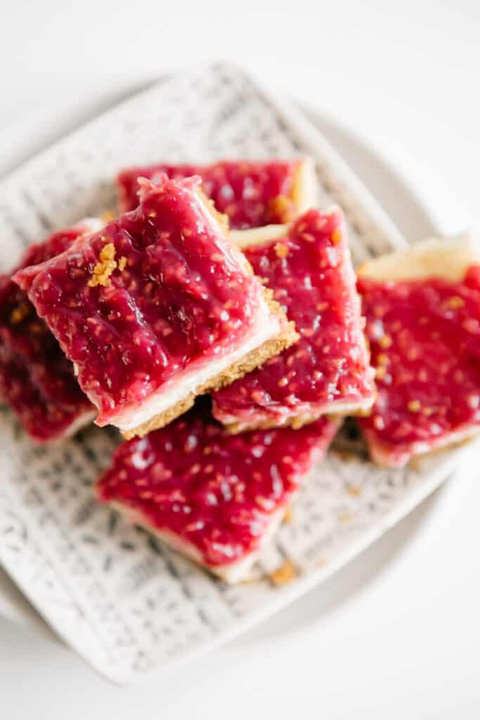 A plate of Raspberry Cheesecake Bars 