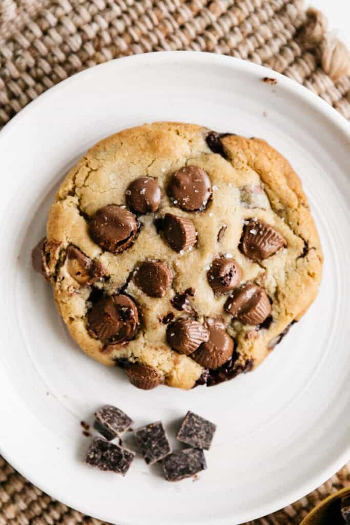 A peanut butter cup cookie on a white plate 