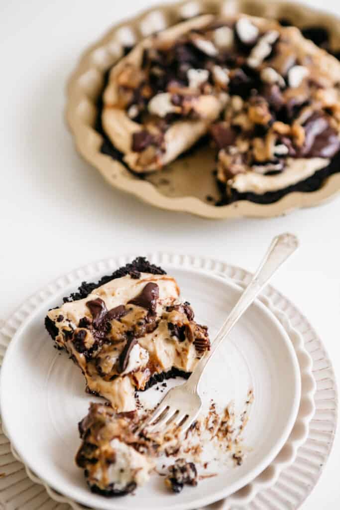 A slice of pie on a white plate 