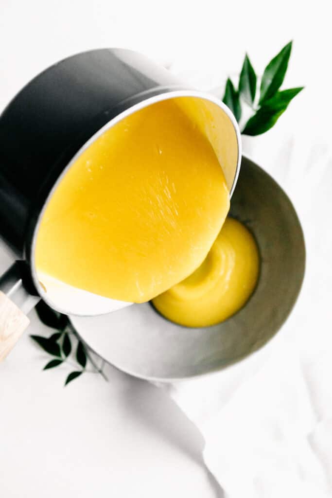 Pouring fresh lemon curd 