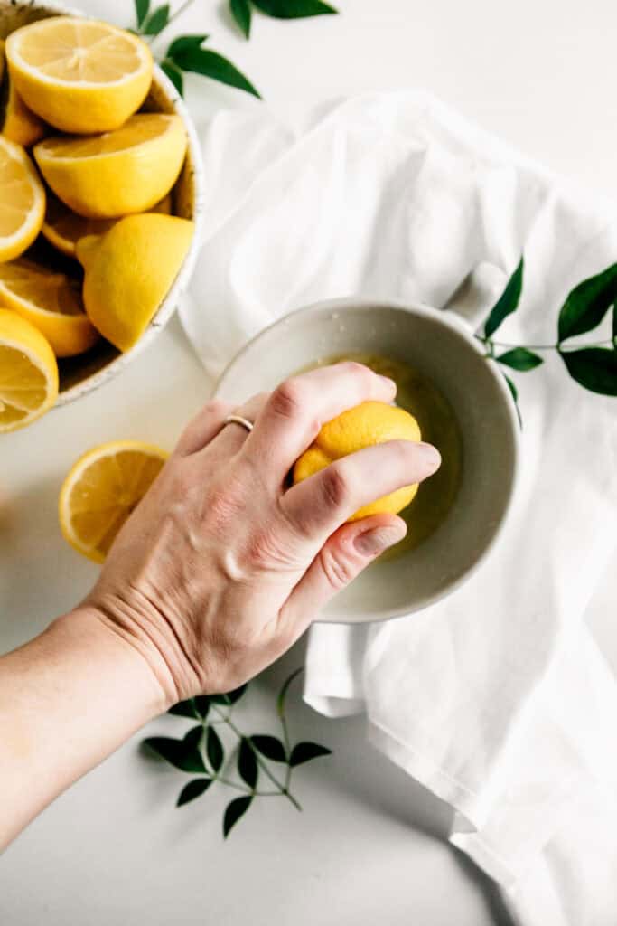 Squeezing lemons into juice 