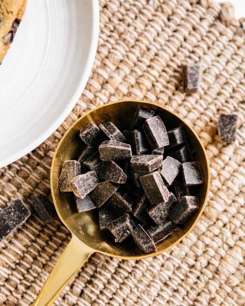 Chocolate chunks in a gold spoon 