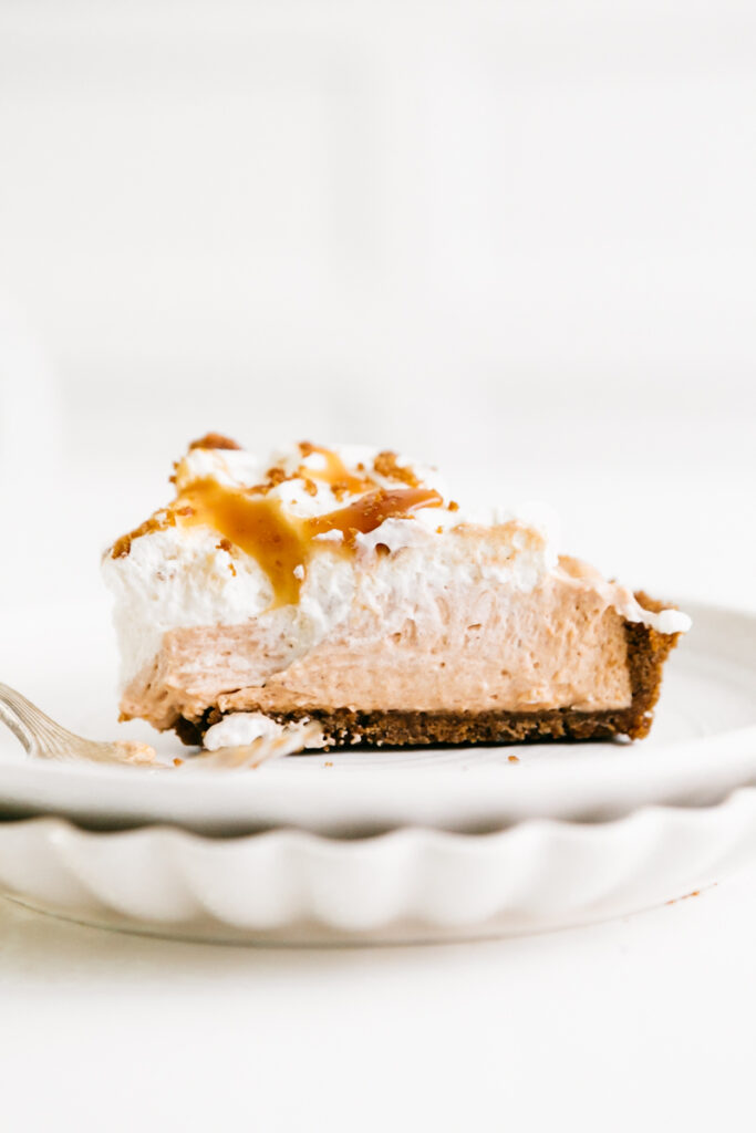 A slice of pie on a white plate 