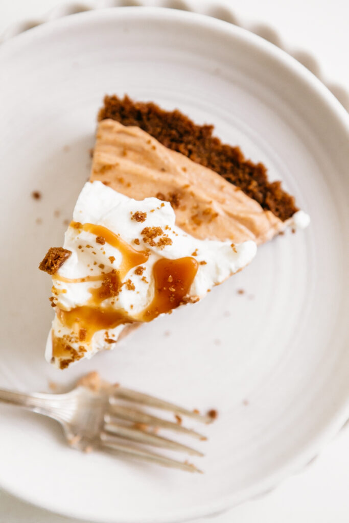 A slice of pie on a white plate 