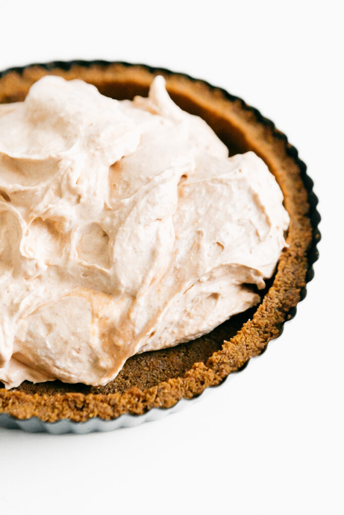 Creamy pumpkin filling in a graham cracker crust 