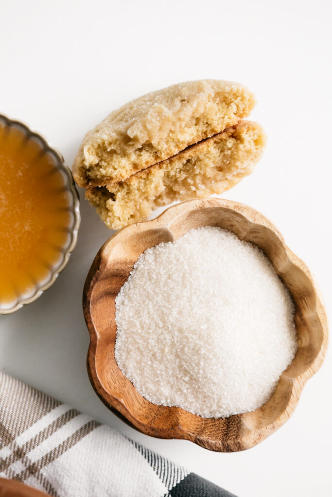 Granulated sugar in a wooden bowl 