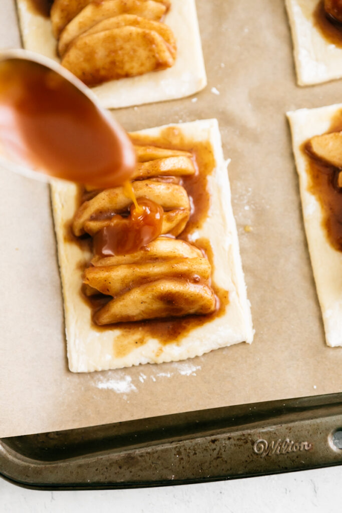 Drizzling caramel onto hand pies 