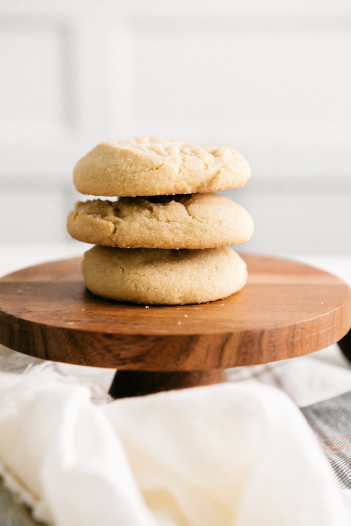 A stack of cookies on a wooden stand 