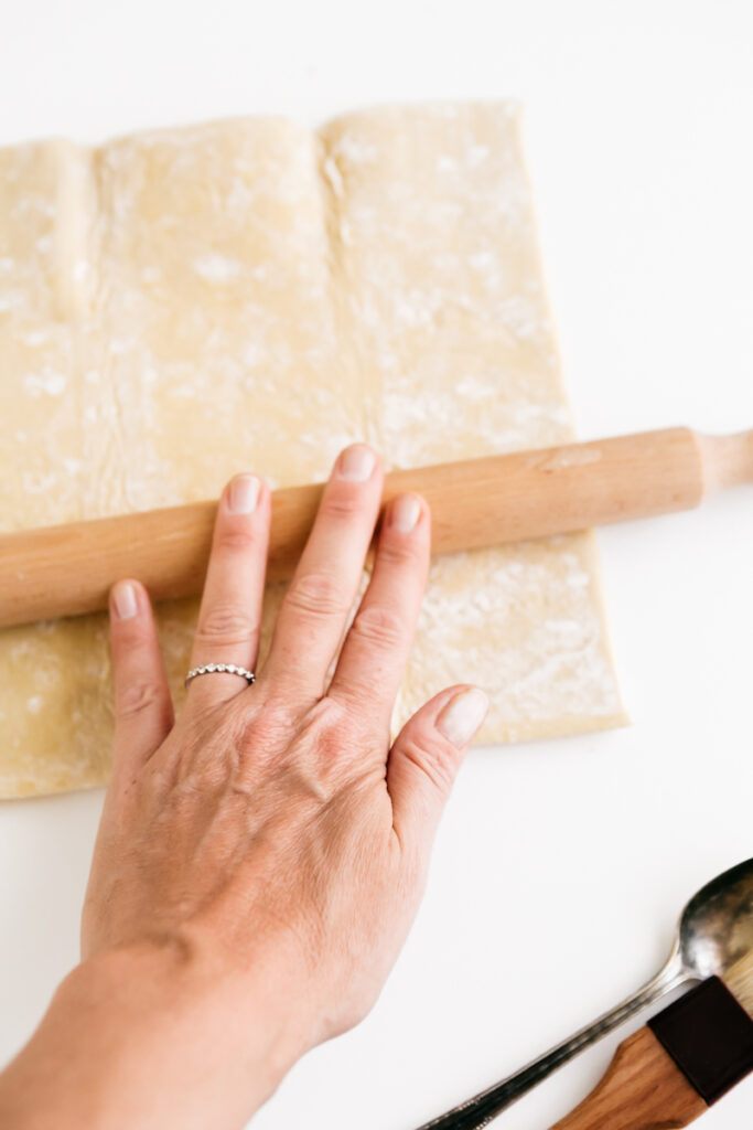 Rolling out puff pastry dough 