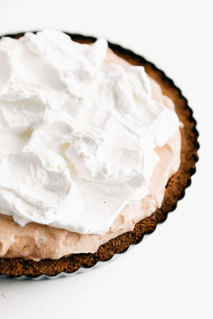 Pie with filling and whipped cream 