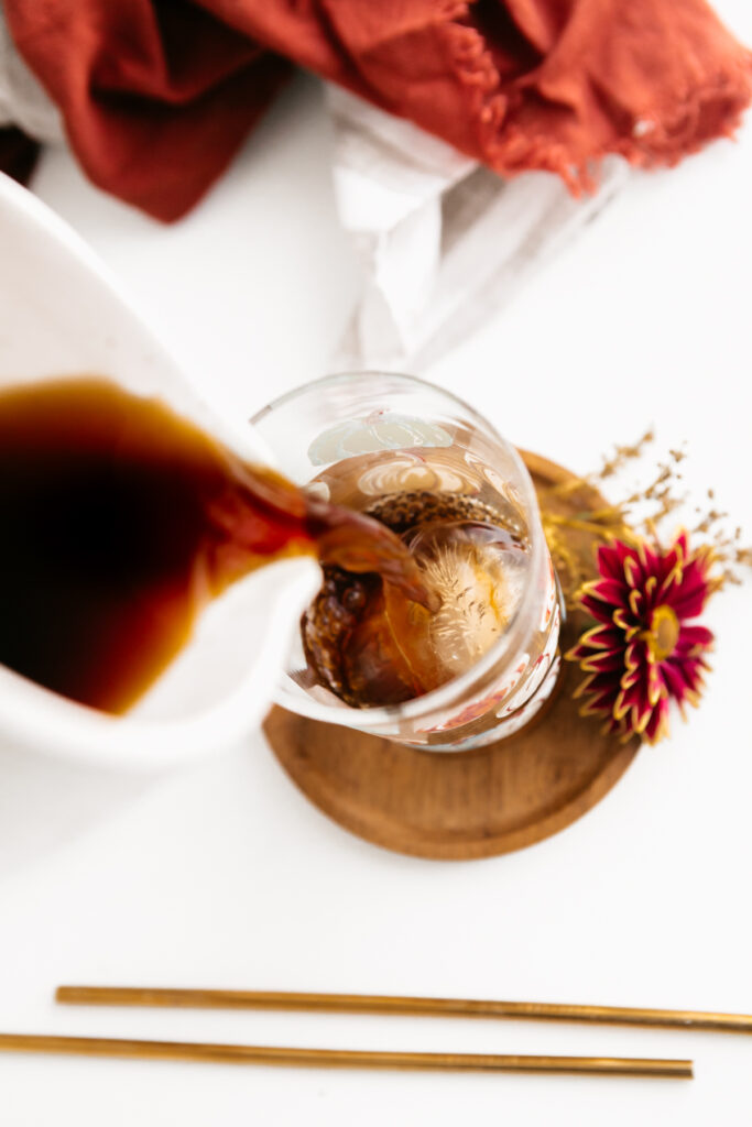 Pouring coffee over ice 