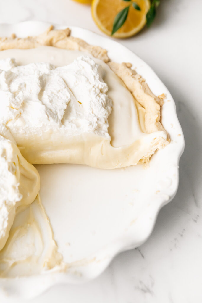 Sour Cream Lemon Pie With a slice out 