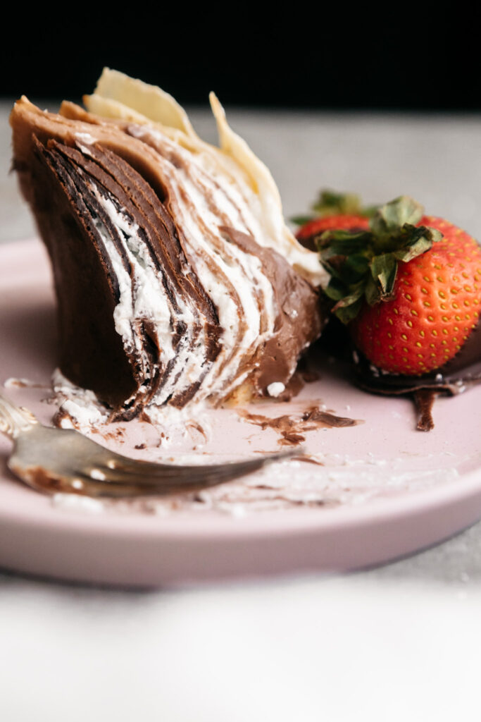 A slice of crepe cake on a plate 