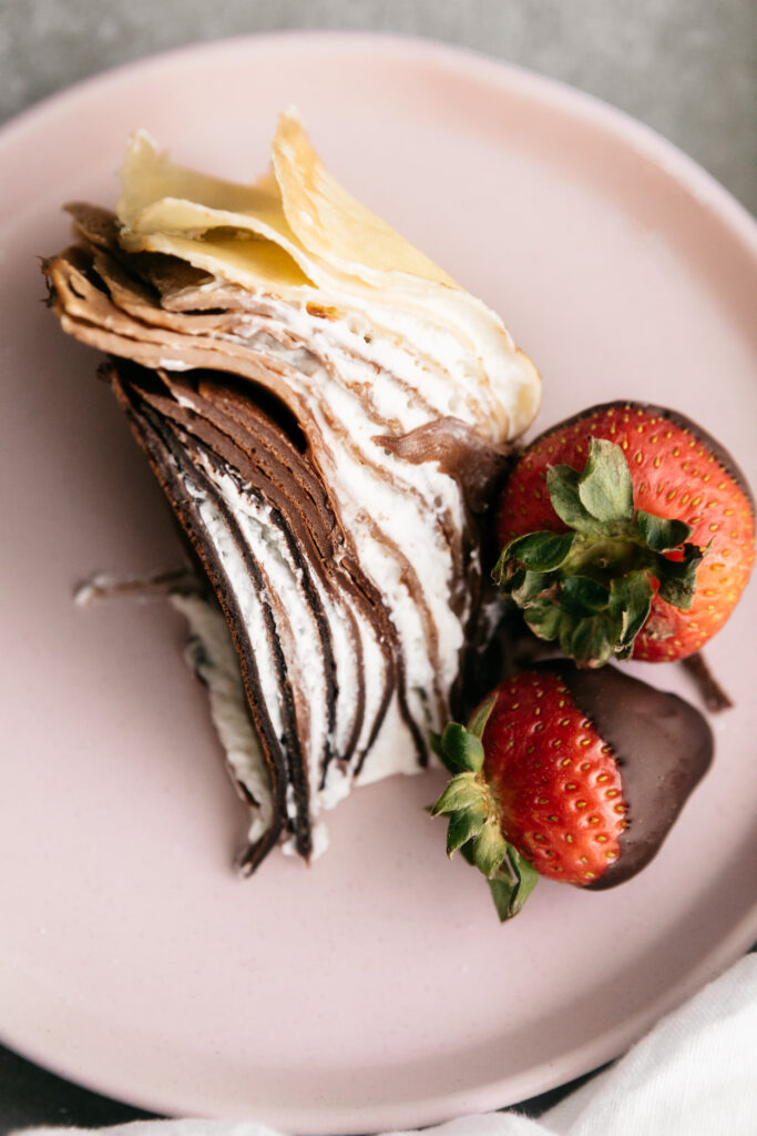 A slice of crepe cake on a plate 