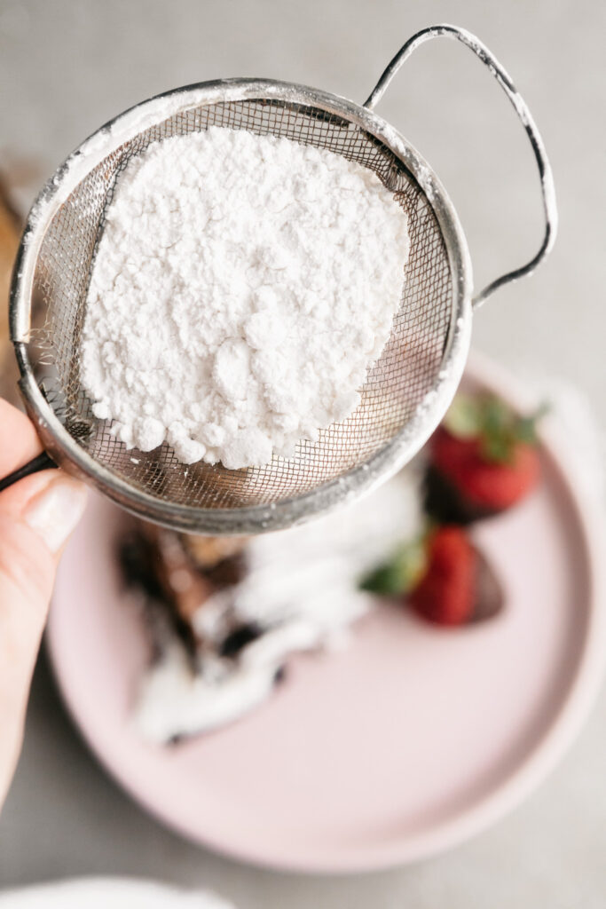 Powdered sugar in a strainer 