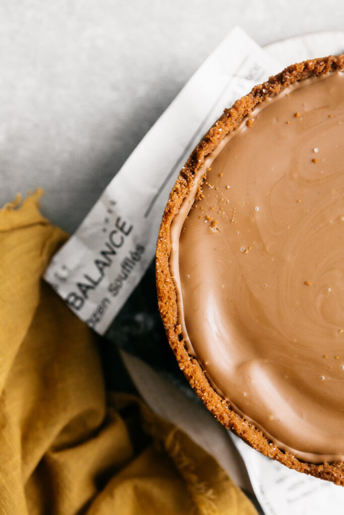 A closeup of the top of a cheesecake 