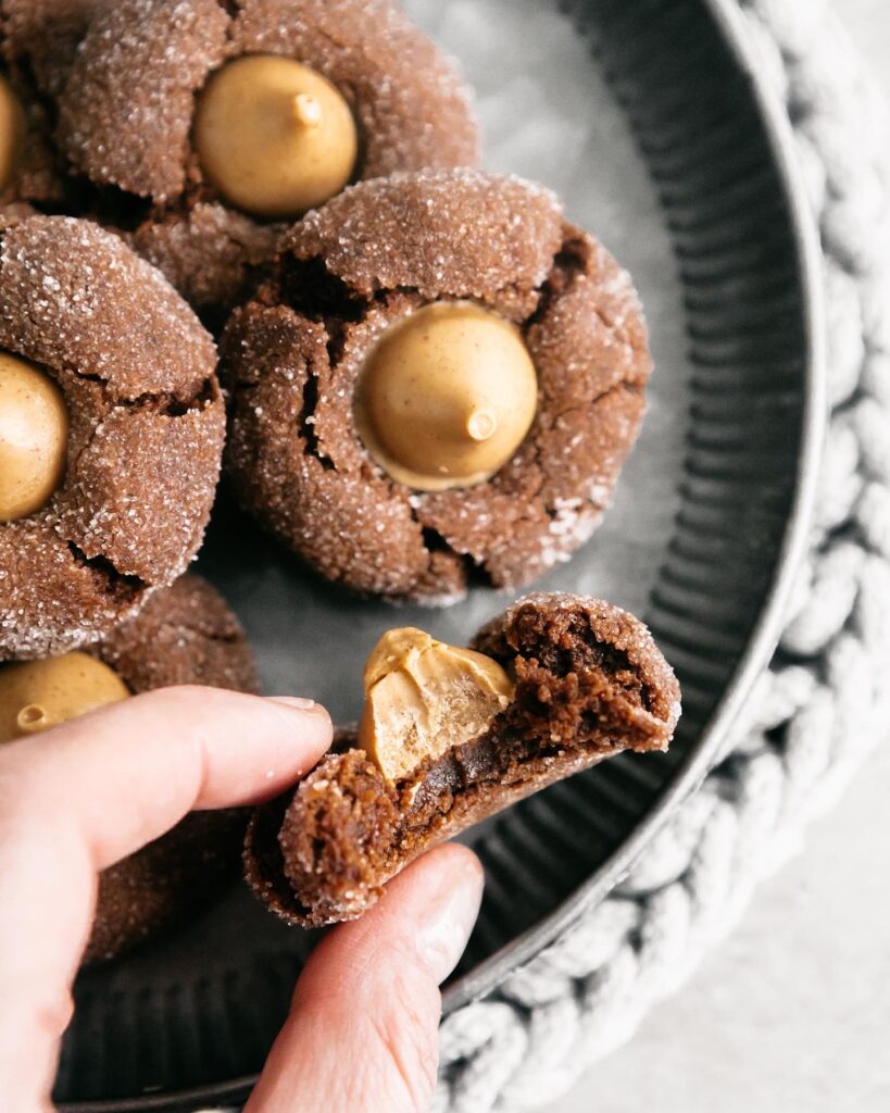Flourless Chocolate Peanut Butter Blossoms With one bit down the center 