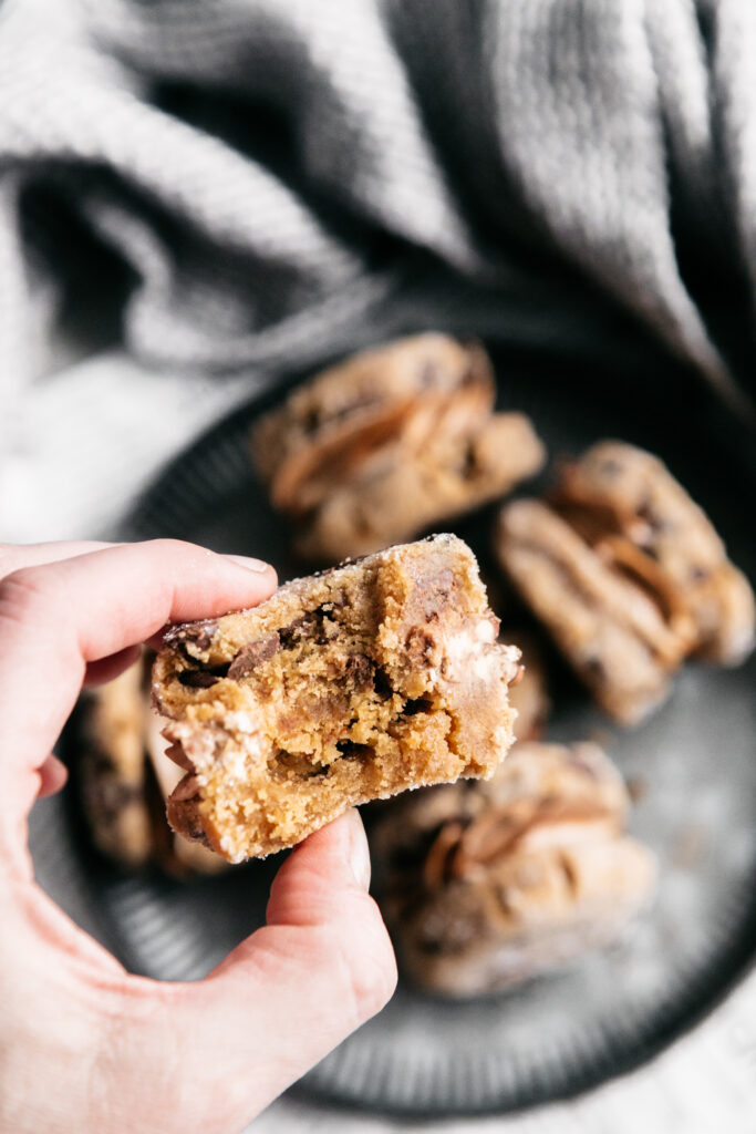 a bite out of a sandwich cookie 