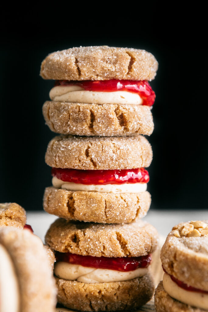 A stack of Flourless Peanut Butter and Jelly Sandwich Cookies 