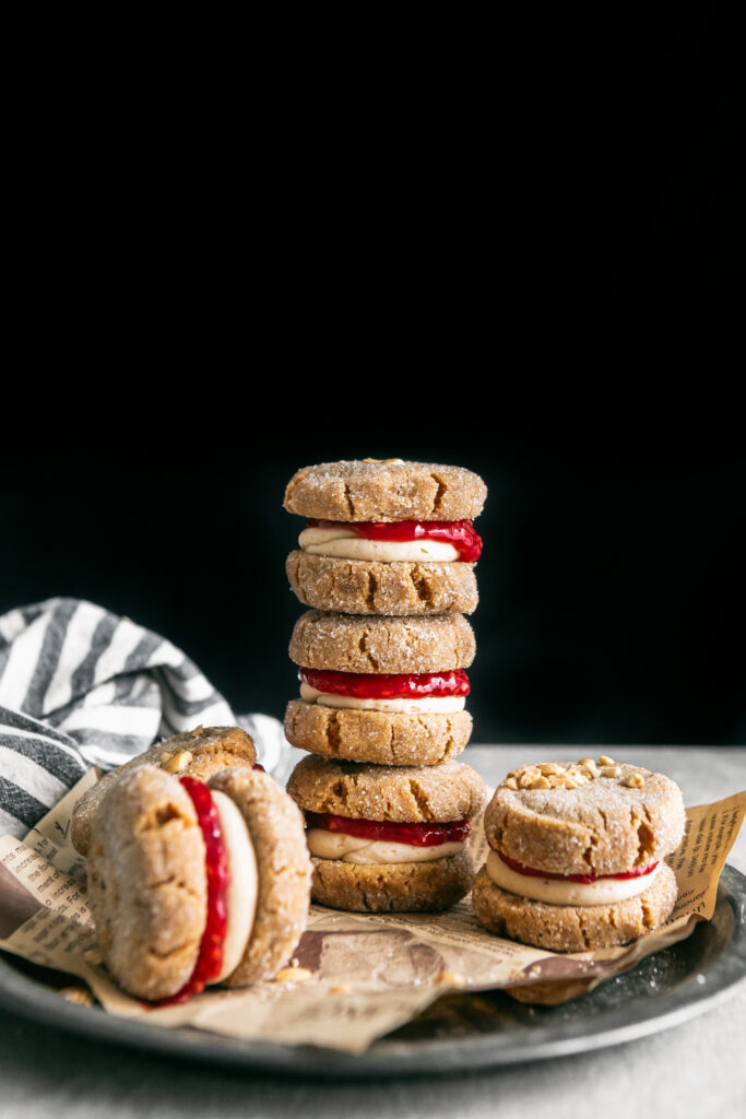 A stack of Flourless Peanut Butter and Jelly Sandwich Cookies 