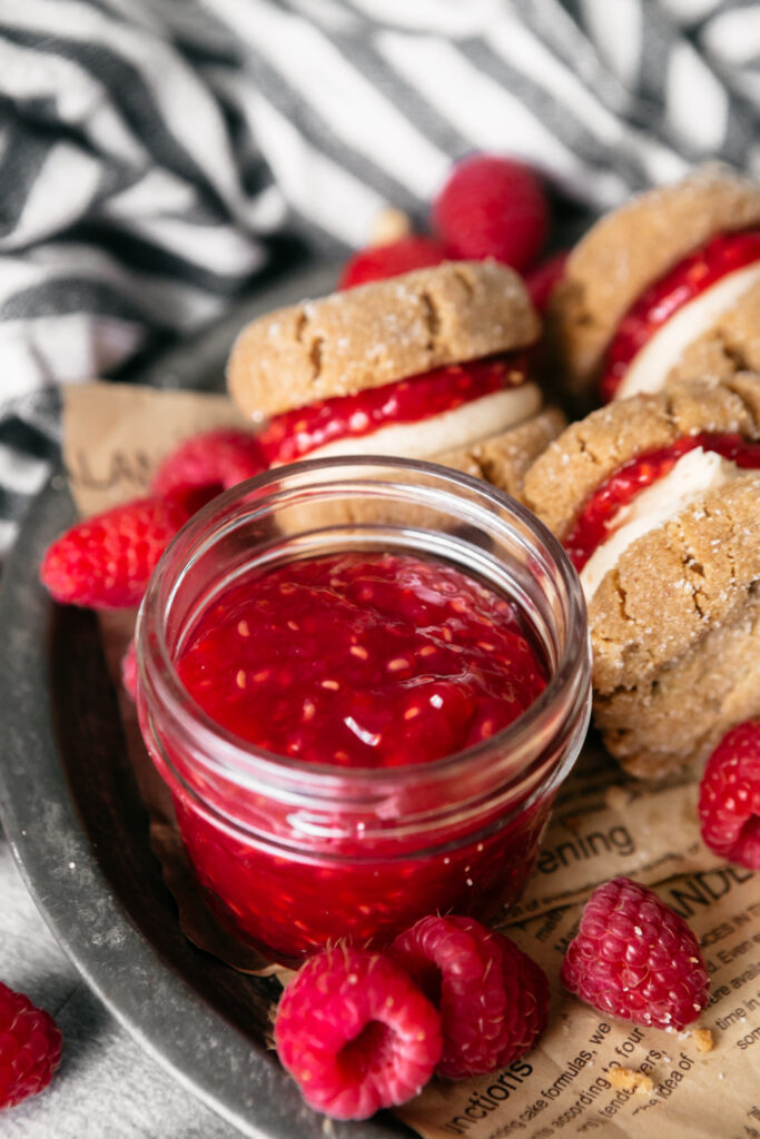 Homemade jam on a plate with cookies 