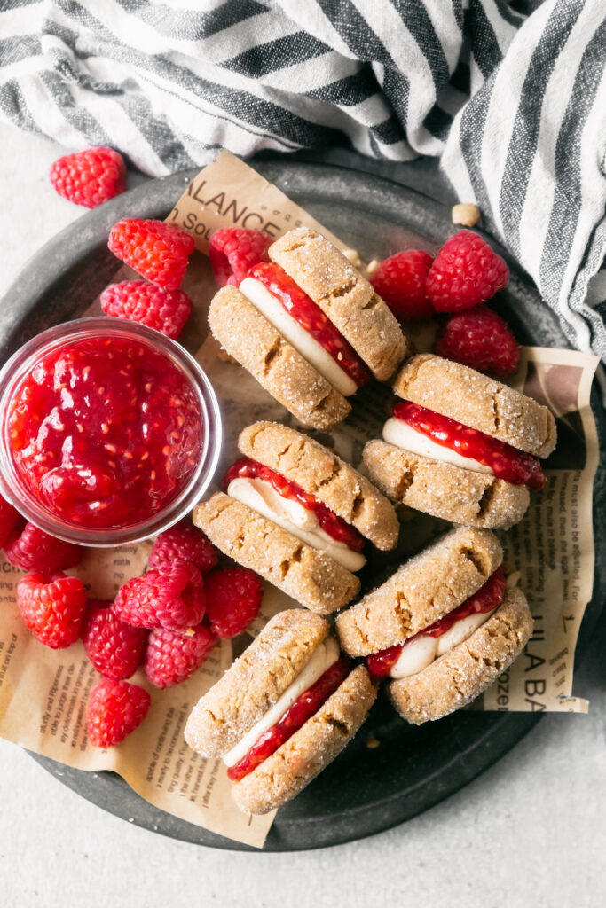 A plate of jam and homemade sandwich cookies 