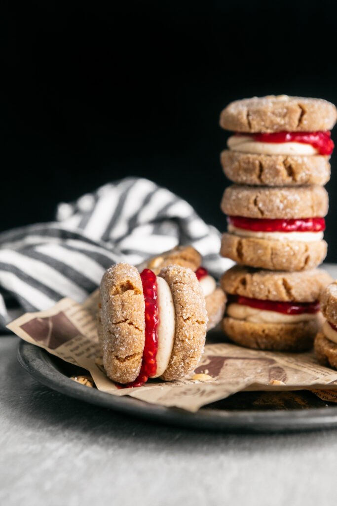 A stack of Flourless Peanut Butter and Jelly Sandwich Cookies 