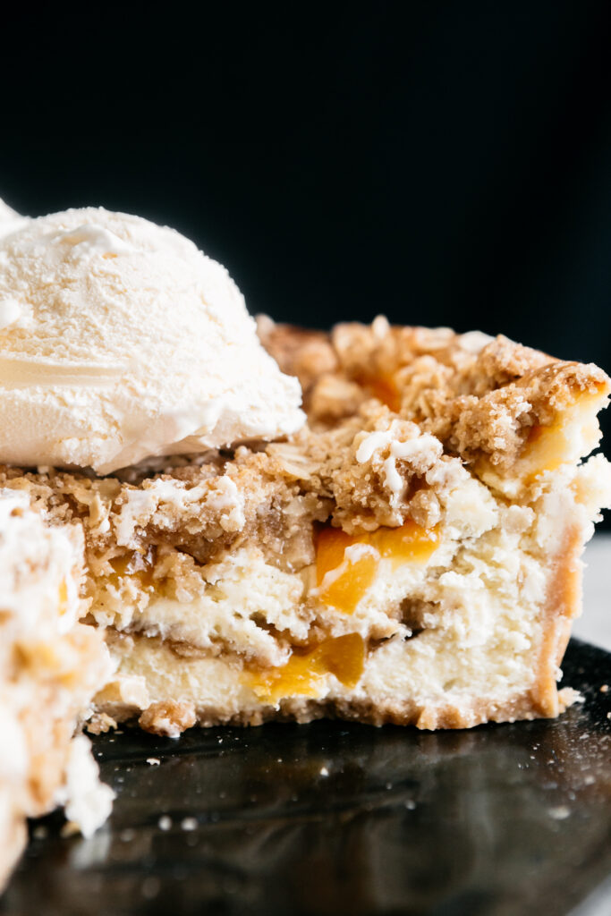 inside of a Browned Butter Peach Crisp Cheesecake 
