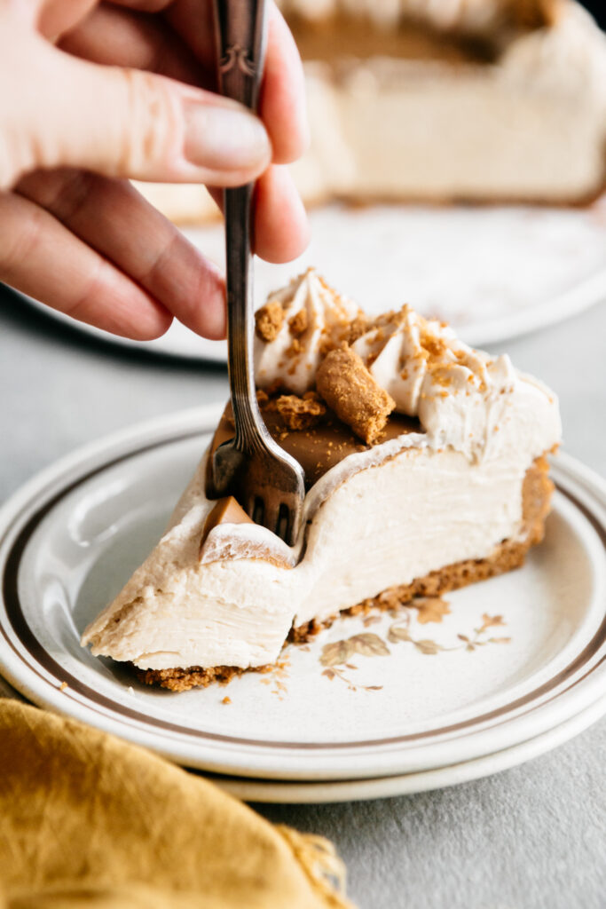 taking a bite of cheesecake with a fork 