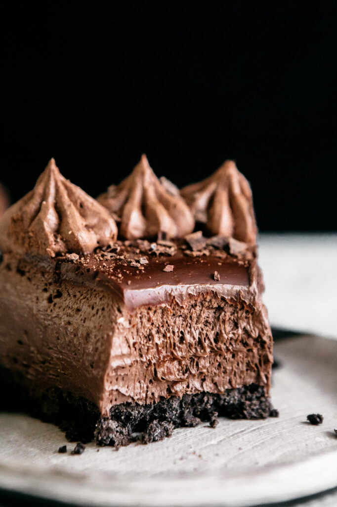 Closeup slice of chocolate cheesecake shot 