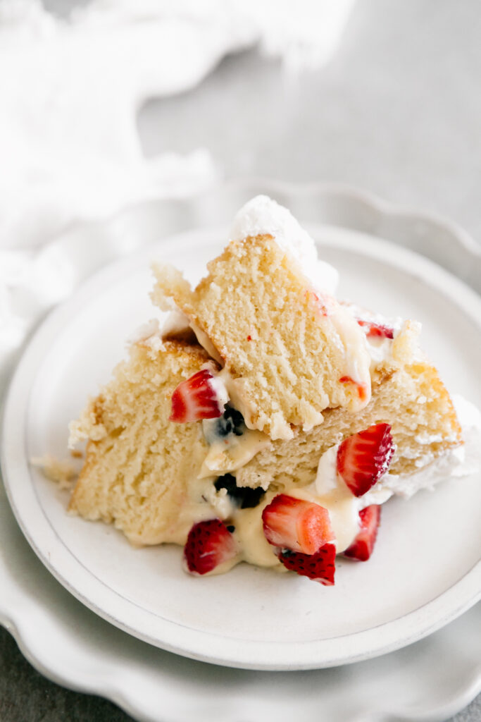 A pile of cake on a white plate 