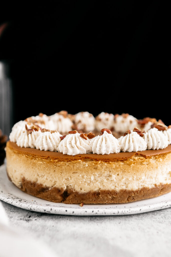 Browned Butter Pecan Cheesecake On a white plate 